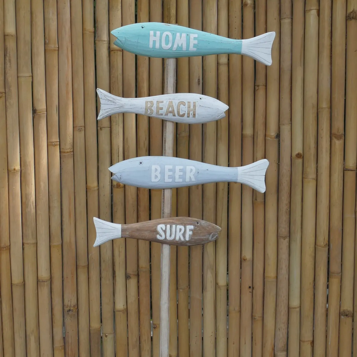  Product image 1 of the product “Stick with 4 colorful  direction signs in shape of fish with the words; Home, Beach, Beer and Surf. Made from wood, total height 150cm. ”